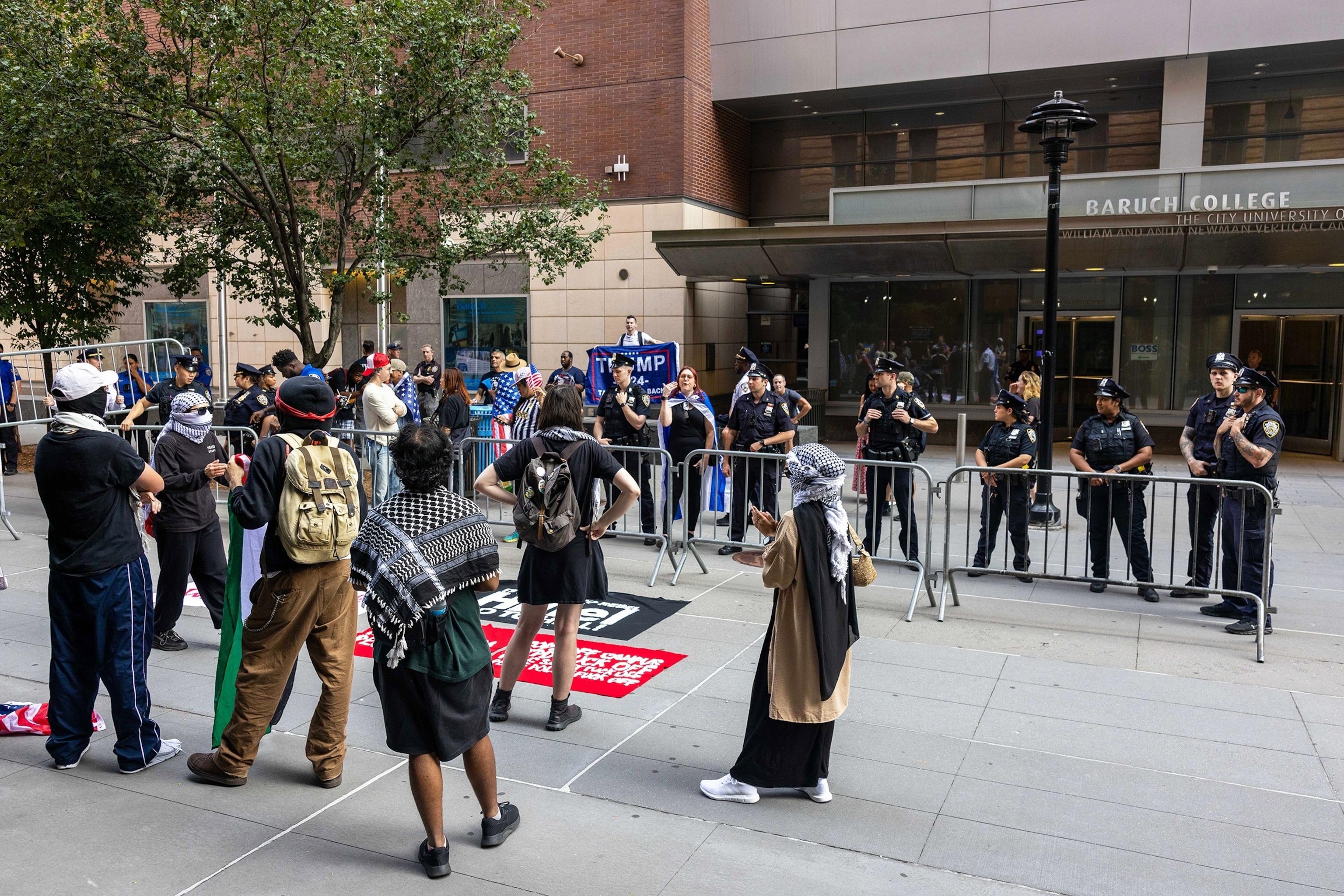 PHOTO: Students demonstrating during a rally in front of Baruch College are confronted by counter-protestors leading police to separate the two groups, on Aug. 24, 2024, in New York.